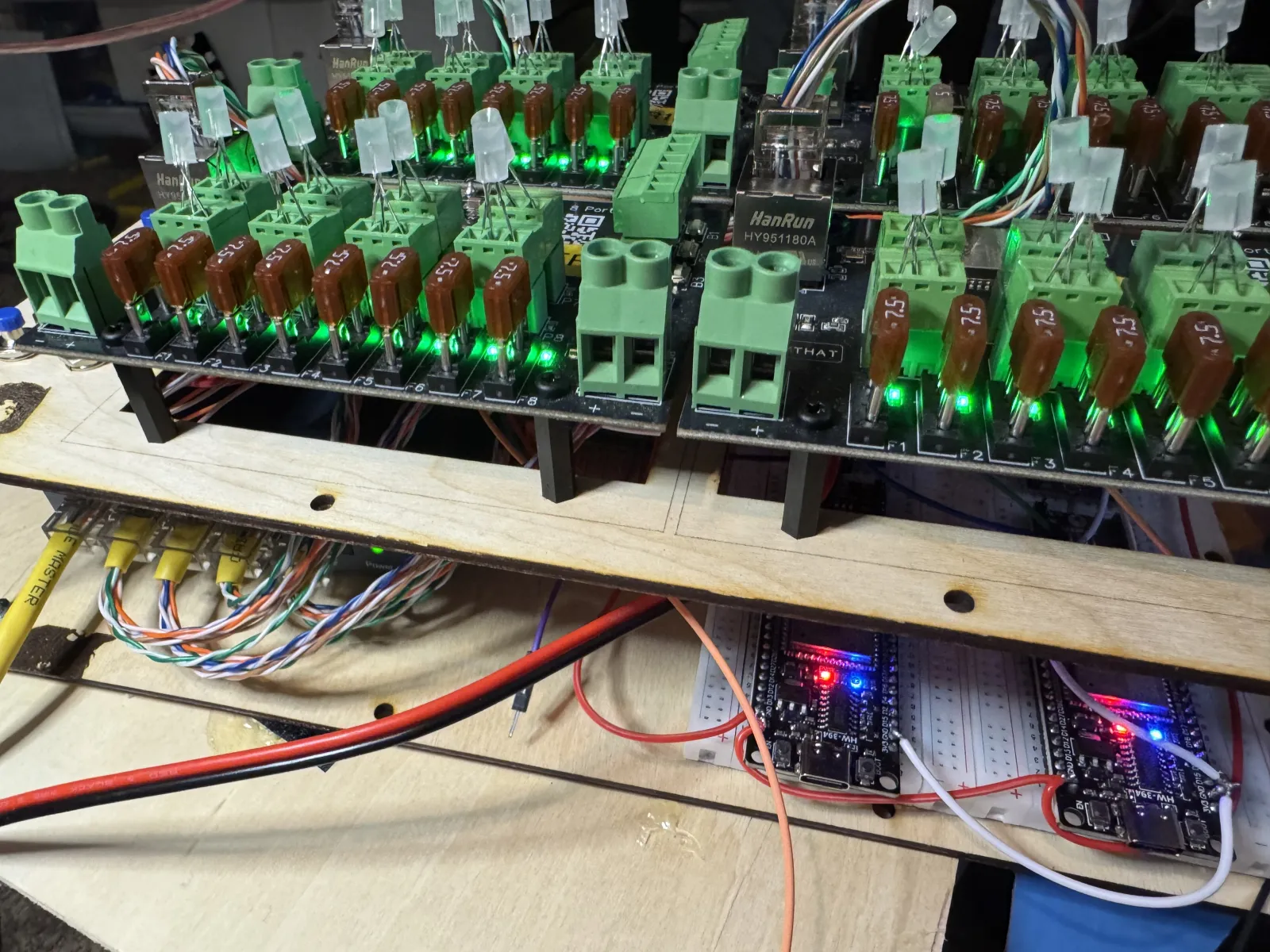 The Kluster development system showing multiple Baldrick boards mounted on wooden framework